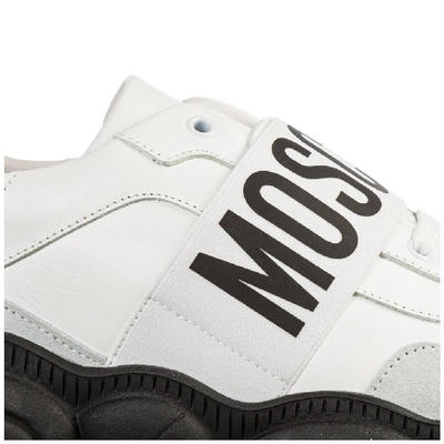 Shop Moschino Logo Strap Low Top Sneakers In White