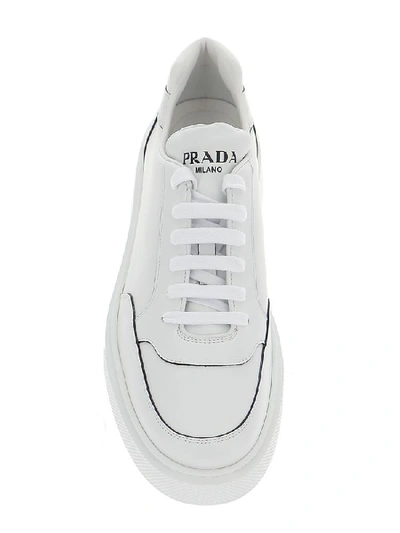 Shop Prada Logo Embossed Panelled Sneakers In White