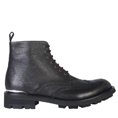 Shop Alexander Mcqueen Logo Engraved Combat Boots In Black