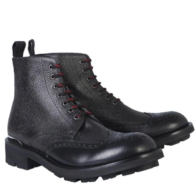 Shop Alexander Mcqueen Logo Engraved Combat Boots In Black