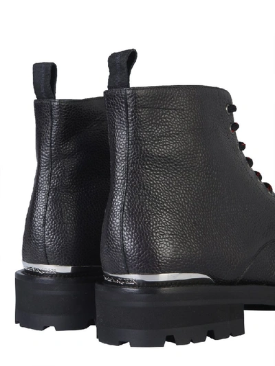 Shop Alexander Mcqueen Logo Engraved Combat Boots In Black