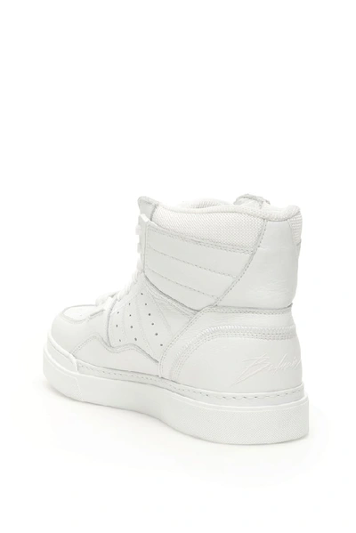 Shop Balmain Kyle High Top Sneakers In White