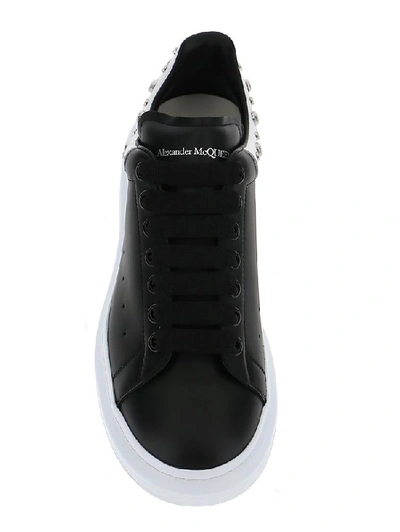 Shop Alexander Mcqueen Studded Oversized Sneakers In Black/white