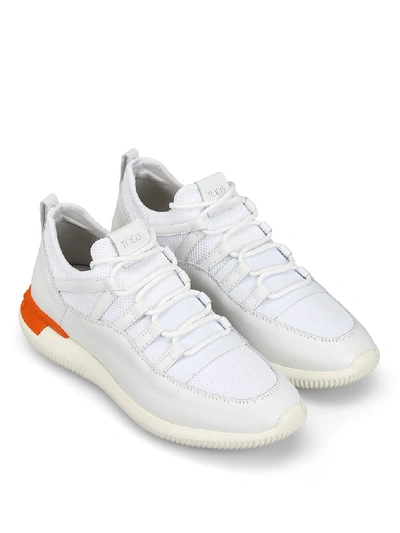 Shop Tod's Low Top Sneakers In White