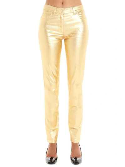Shop Moschino Smeared Effect Slim Fit Trousers In Gold
