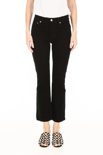 Shop Re/done Mid Rise Flared Jeans In Black