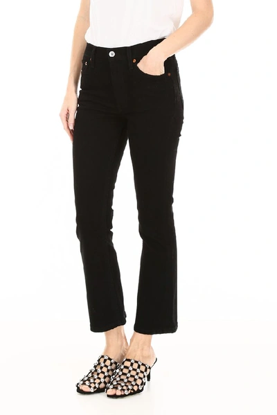 Shop Re/done Mid Rise Flared Jeans In Black