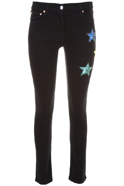 Shop Valentino Star Patches Skinny Jeans In Black