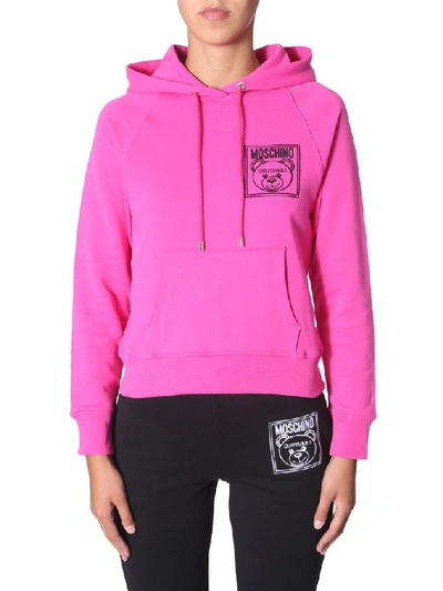 Shop Moschino Teddy Logo Hoodie In Pink