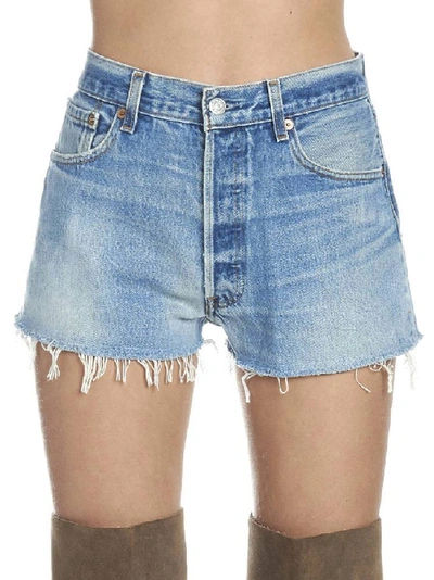 Shop Re/done Distressed Mini Shorts In Blue