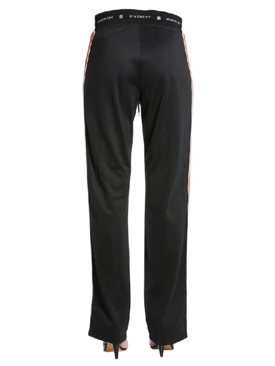 Shop Givenchy Striped Detail Jogging Pants In Black