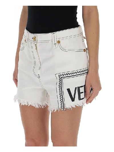 Shop Versace Frayed Denim Shorts In White