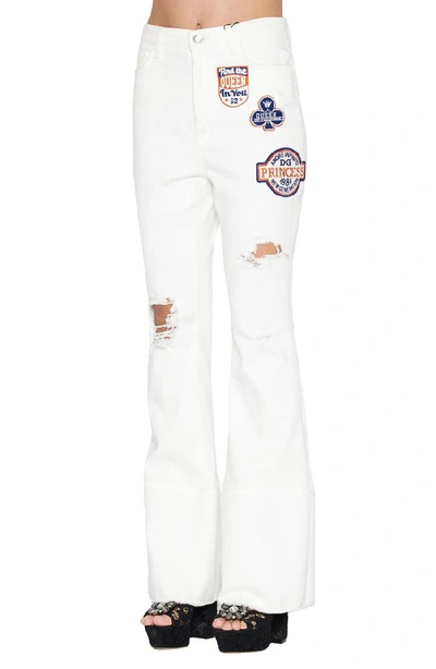 Shop Dolce & Gabbana Patches Flared Jeans In White