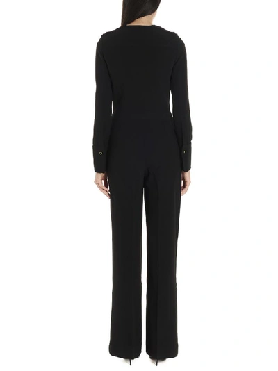 Shop Stella Mccartney Flared Long Sleeved Jumpsuit In Black