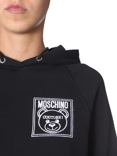 Shop Moschino Teddy Logo Hoodie In Black