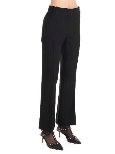 Shop Valentino Flared Tailored Trousers In Black