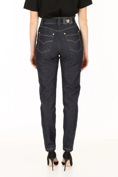 Shop Versace Tapered Jeans In Blue