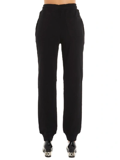 Shop Moschino Logo Print Track Pants In Black