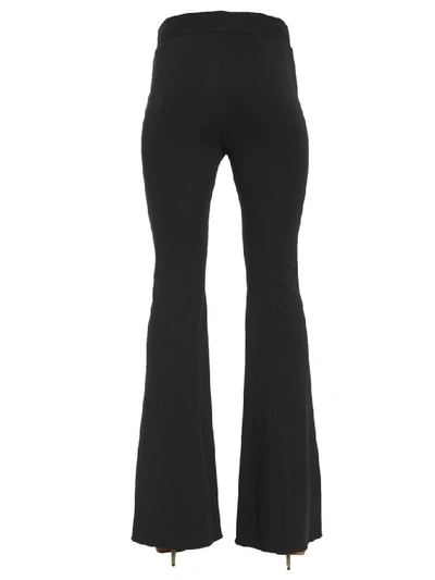 Shop Givenchy Flared Trousers In Black