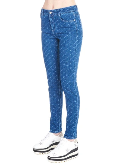 Shop Stella Mccartney All Over Logo Jeans In Blue