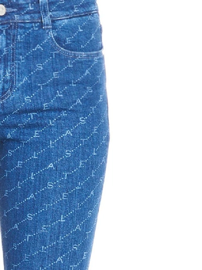 Shop Stella Mccartney All Over Logo Jeans In Blue