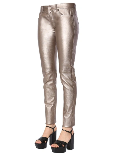 Shop Saint Laurent Skinny Fit Metallic Pants In Gold