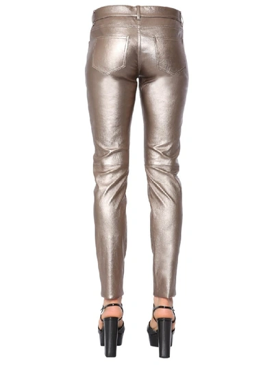 Shop Saint Laurent Skinny Fit Metallic Pants In Gold