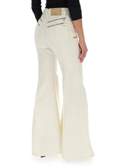 Shop Chloé Flared Front Zip Pants In White
