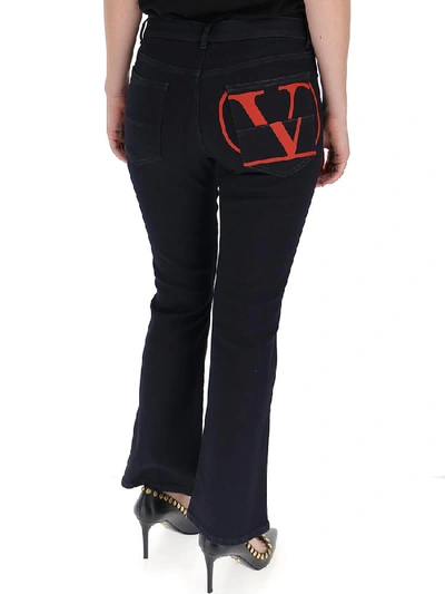 Shop Valentino Garavani Vlogo Printed Flared Jeans In Blue Denim