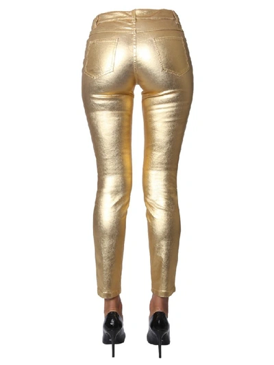 Shop Moschino Metallic Mid Rise Slim Fit Trousers In Gold