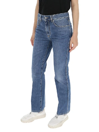 Shop Givenchy Bootcut Faded Jeans In Blue