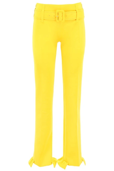 Shop Prada Ruffled Hem Belted Pants In Yellow