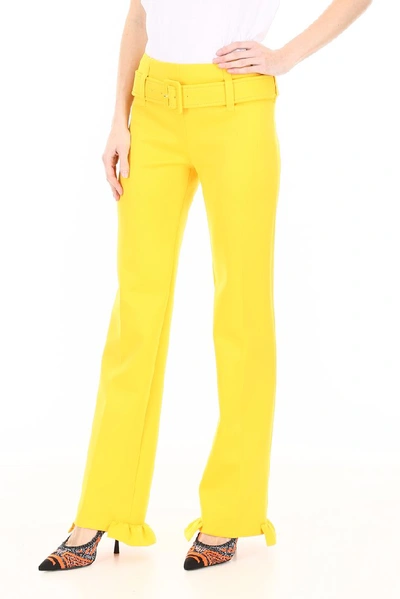 Shop Prada Ruffled Hem Belted Pants In Yellow