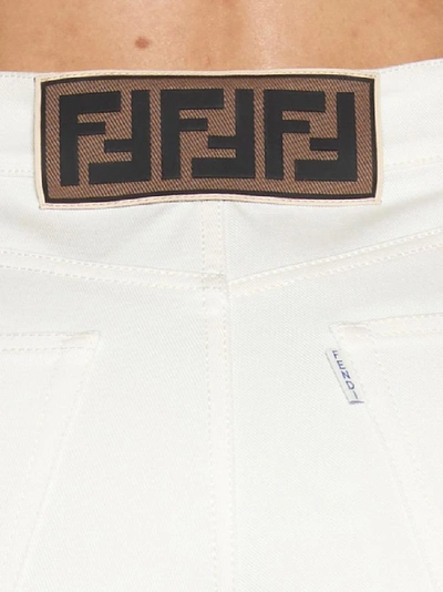 Shop Fendi Cropped Flared Jeans In White