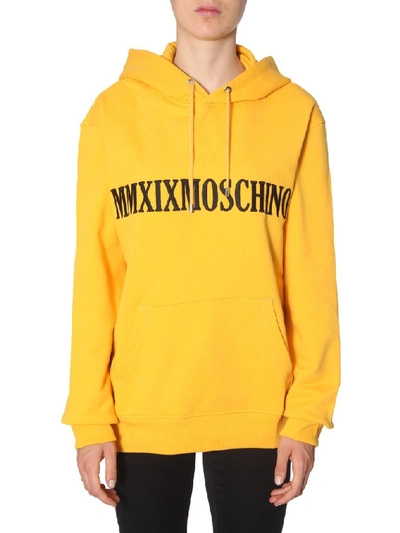 Shop Moschino Logo Embroidered Hoodie In Fuchsia