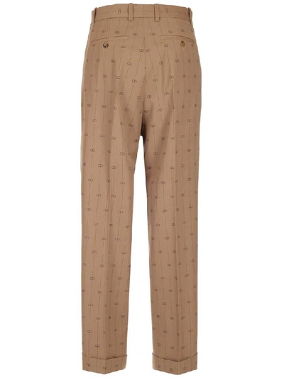 Shop Gucci Gg Striped Trousers In Beige