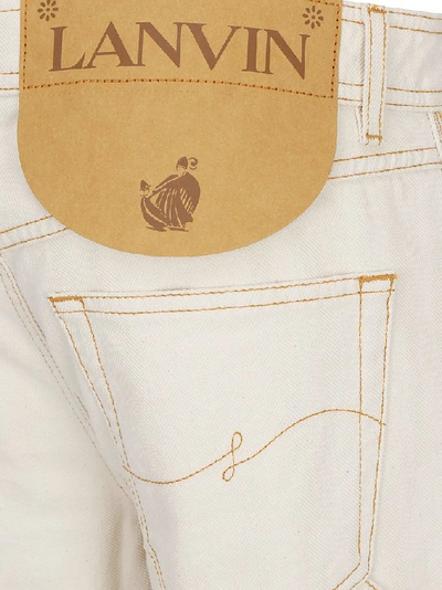Shop Lanvin Asymmetric Hem Detail Jeans In Beige