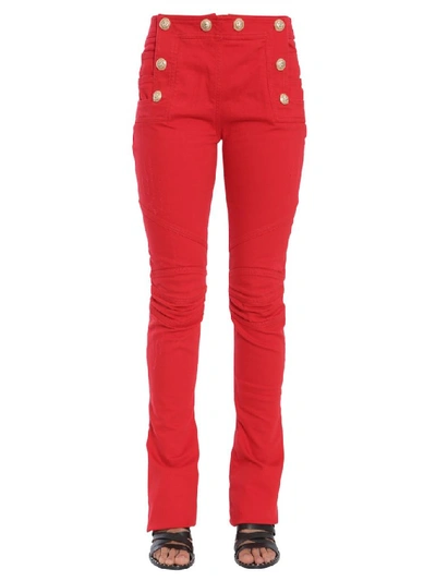 Shop Balmain Button Embellished Flare Jeans In Red