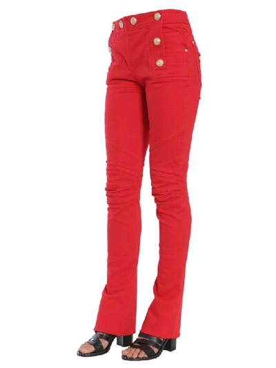 Shop Balmain Button Embellished Flare Jeans In Red