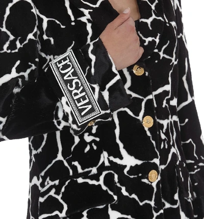 Shop Versace Marble Print Coat In Black