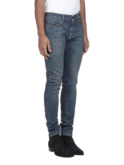 Shop Saint Laurent Ripped Skinny Jeans In Blue