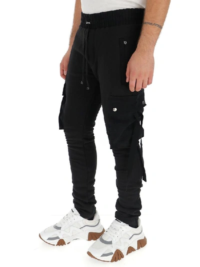 Shop Amiri Tapered Track Pants In Black