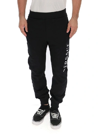 Shop Versace Logo Printed Track Pants In Black
