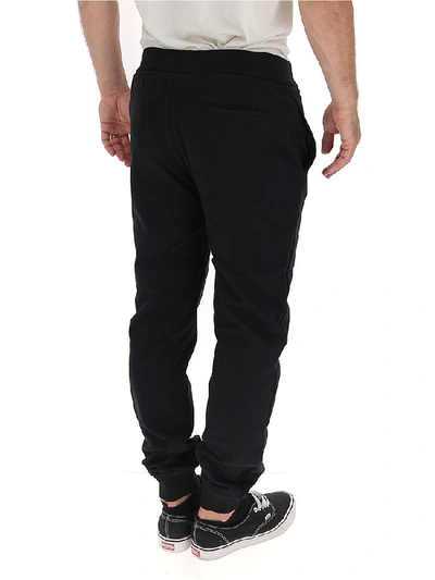 Shop Versace Logo Printed Track Pants In Black