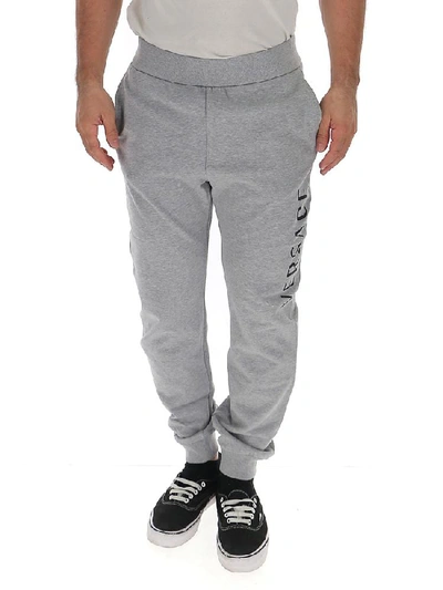 Shop Versace Logo Printed Track Pants In Grey