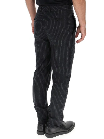 Shop Saint Laurent Pinstriped Trousers In Black