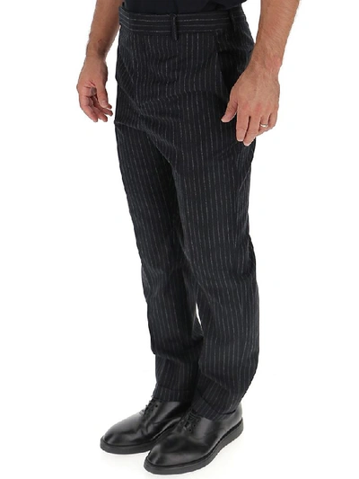 Shop Saint Laurent Pinstriped Trousers In Black