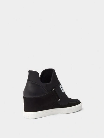 Shop Donna Karan Dkny Women's Cosmos Wedge Slip-on Sneaker - In Black