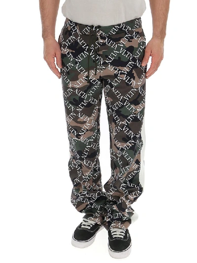 Shop Valentino Vltn Camouflage Pants In Multi