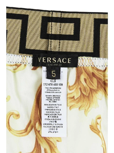 Shop Versace Greca Trimmed Swim Shorts In Yellow